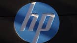 Hewlett-Packard Co's quarterly profit slid  percent but the world's largest personal computer maker raised the lower end of its full-year outlook as revenue from services to corporations slightly offset shrinking PC sales.