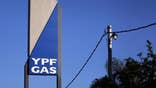 A year after Argentina seized the local business of Spanish oil firm Repsol , there seems little prospect of a quick deal on compensation despite signs that both sides would rather avoid a costly, drawn-out legal battle.