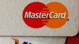 A group of U.S. retailers, including Macy's Inc.  and Target Corp. , sued Visa Inc.  and MasterCard Inc.  on Thursday, breaking off from a proposed $.