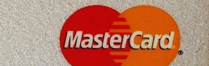 A group of U.S. retailers, including Macy's Inc.  and Target Corp. , sued Visa Inc.  and MasterCard Inc.  on Thursday, breaking off from a proposed $.