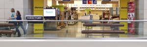 U.S. retailer Sears Holdings  reported a larger-than-expected quarterly loss as cooler weather hurt sales at its department stores and said it was considering a sale of its protection agreement business to shore up liquidity.