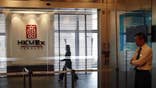 Three men were charged on Friday in a Hong Kong court with possessing false documents including a check for $ million in connection with an investigation into the city's shuttered Hong Kong Mercantile Exchange.