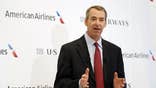 A plan by American Airlines' parent to exit bankruptcy and merge with US Airways Group  is coming under fire from the U.S. Department of Justice over nearly $ million in severance pay earmarked for outgoing boss Tom Horton.