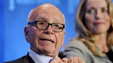 News Corp said on Friday it will write down the value of its Australian and U.S. publishing assets by up to $.