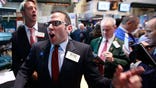 QE Mania: The markets ended sharply higher, but trading was choppy as market participants parsed signals about the Fed's asset-buying program.