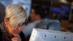 Bourses across Europe were in the red on Friday, extending losses from the previous session, as traders continued fretting about central bank easing.