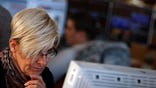 Bourses across Europe were in the red on Friday, extending losses from the previous session, as traders continued fretting about central bank easing.
