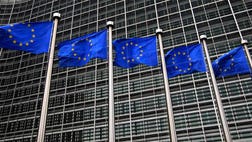 The European Commission said the country must stick to targets agreed with international lenders if it wants more time to repay bailout loans.