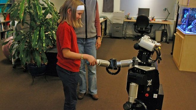 A child interacting with Robovie