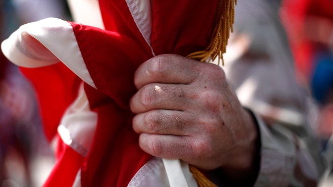 Soldier-Holds-Flag