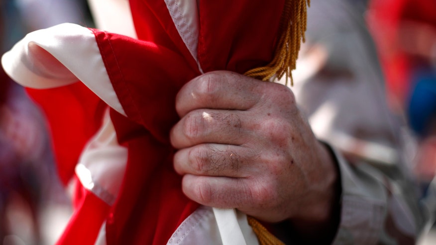 Soldier-Holds-Flag