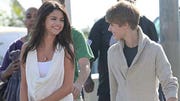 Justin Bieber is wanted for questioning after a photographer complained of being roughed up by the pop star at a shopping center.
