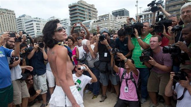 http://a57.foxnews.com/global.fncstatic.com/static/managed/img/fn-latino/lifestyle/660/371/BRAZIL%20TOPLESS%20PROTEST.jpg?ve=1&tl=1