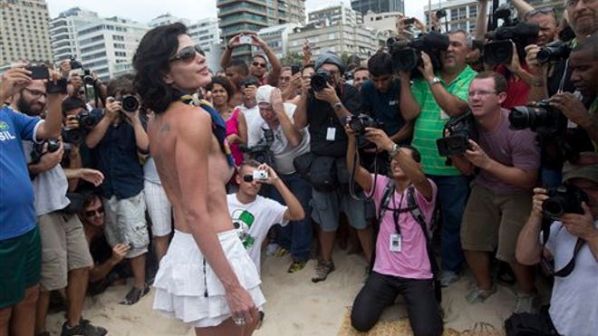 http://a57.foxnews.com/global.fncstatic.com/static/managed/img/fn-latino/lifestyle/660/371/BRAZIL%20TOPLESS%20PROTEST.jpg?ve=1&tl=1