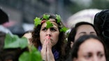 Thousands brave rain and come out to decry violence against women