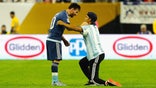 Fan invades pitch at U.S.-Argentina match, bows down to Messi