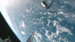 >NASA's newest delivery service pulled up at the International Space Station on Sunday after a week's delay, bringing more than a half-ton of meals and special treats to the astronauts who assisted in the high-flying feat.