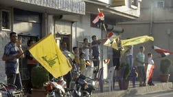 Fighters from Lebanon's Hezbollah joined Syrian troops battling rebels near Damascus on Wednesday, monitors said, as President Bashar al-Assad's regime kept up a push to cut off the insurgents' supply lines.