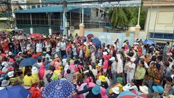 Cambodia's strongman Prime Minister Hun Sen on Wednesday warned garment workers that protests demanding higher wages could push manufacturers to quit the country.