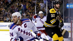  Johnny Boychuk broke a tie midway through the second period, and the Boston Bruins scored two goals in the third to beat the New York Rangers - on Sunday and take a - lead in the Eastern Conference semifinal series.
