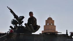  A major Tunisian security presence has surrounded the country's main religious center and prevented hardline Muslims from holding their annual gathering.