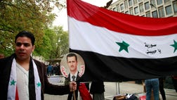  Syrian activists say government airstrikes and heavy shelling of a strategic town near the Lebanese border have killed at least  people, including rebel fighters.
