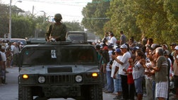  Residents of a western Mexico area who endured months besieged by a drug cartel cheered the arrival of hundreds of Mexican soldiers Monday.