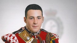  Britain's military says the soldier brutally murdered in a suspected terrorist attack was a popular drummer and machine gunner, a father, and a passionate fan of Manchester United.