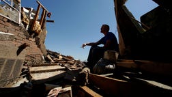  A band of thunderstorms is battering the Oklahoma City area and slowing cleanup operations in the southern suburb where a tornado killed  people and destroyed thousands of homes earlier this week.