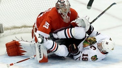  Jakub Kindl scored on a power play in the second period, Daniel Cleary had an empty-net goal and Jimmy Howard made  saves to help the Detroit Red Wings hold on for a - victory over the Chicago Blackhawks on Thursday night, putting the NHL's best team during the regular season on the brink of elimination.