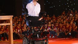  The , people at the soccer stadium and the millions more watching at home waited  minutes before the Australian evangelical preacher got to the message he had come to Communist-ruled Vietnam to deliver.