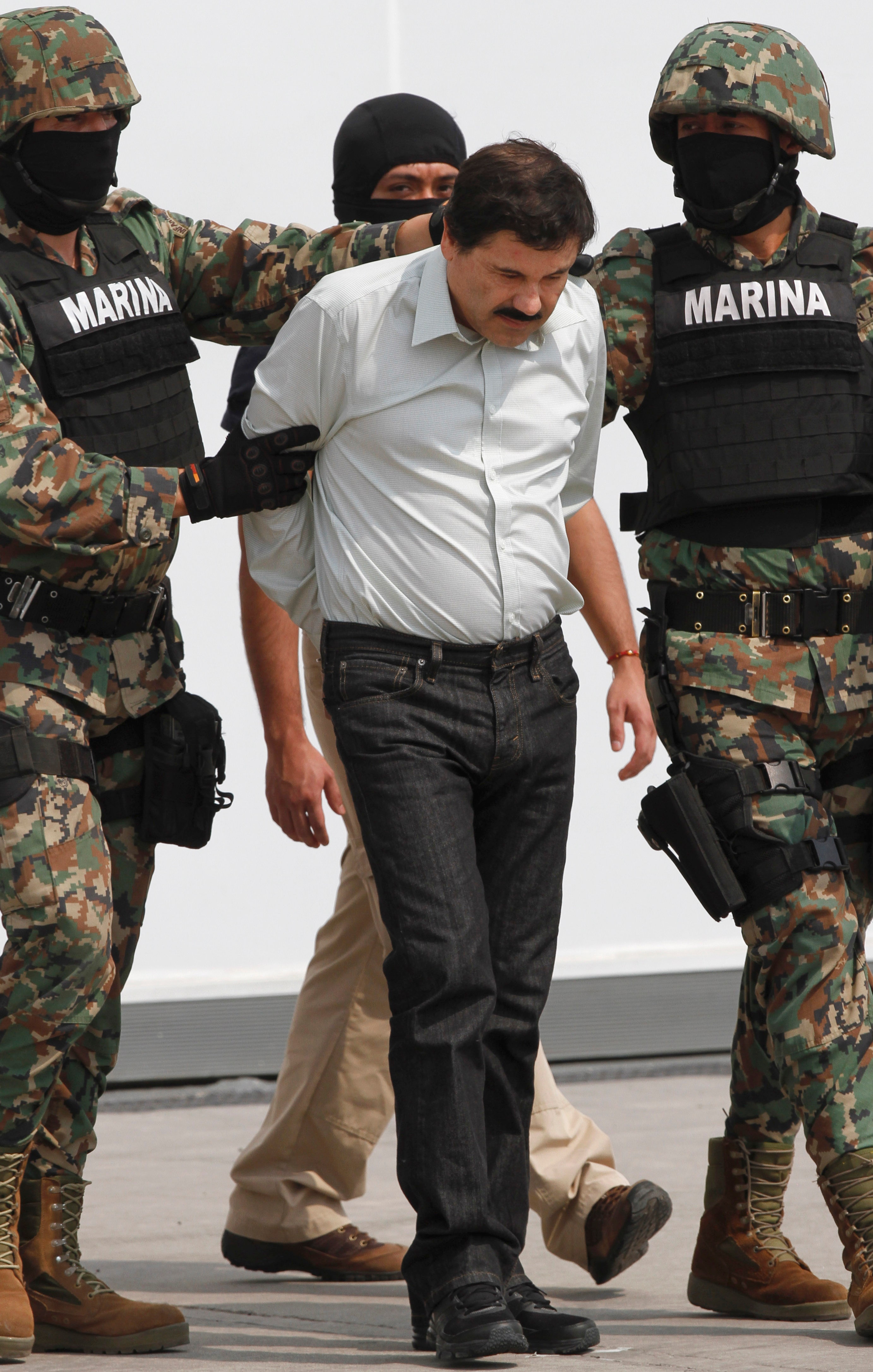 Mexico's most-wanted capo Joaquin 'El Chapo' Guzman looks pudgy, bowed post-arrest | Fox News