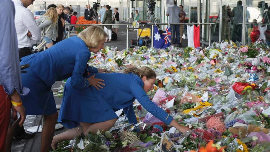 http://a57.foxnews.com/global.fncstatic.com/static/managed/img/fn2/feeds/Associated%20Press/2014/07/22/876/493/APTOPIX%20Netherlands%20Ukraine%20Plane-2.jpg?ve=1&tl=1