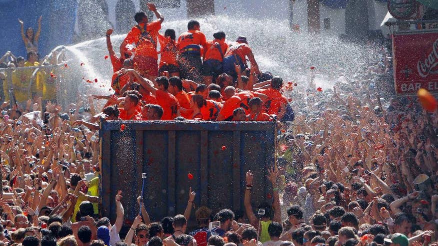 Spanish town drenched in red pulp as thousands take part in annual ‘Tomatina’ tomato battle