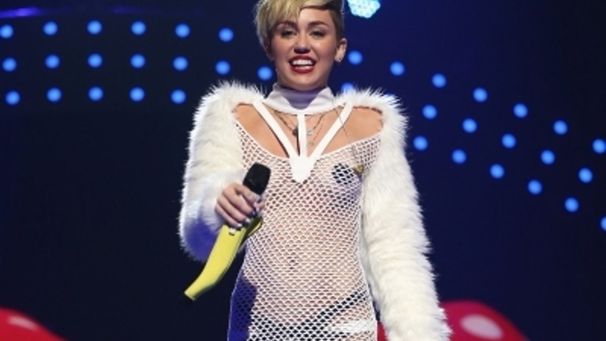 miley-cyrus-nipple-pasties-iheartradio-092113-5-400x300