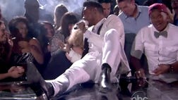 Miguel shocked everyone during the Billboard Music Awards on May , when he accidentally landed on two young women during his performance.