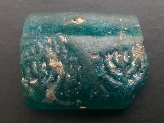 Ancient glass bracelet decorated with menorahs found in Israel