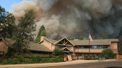 >One of the worst wildfires in California's history continues to burn in Yosemite National Park, where employees will be furloughed following the government failure to pass a budget.