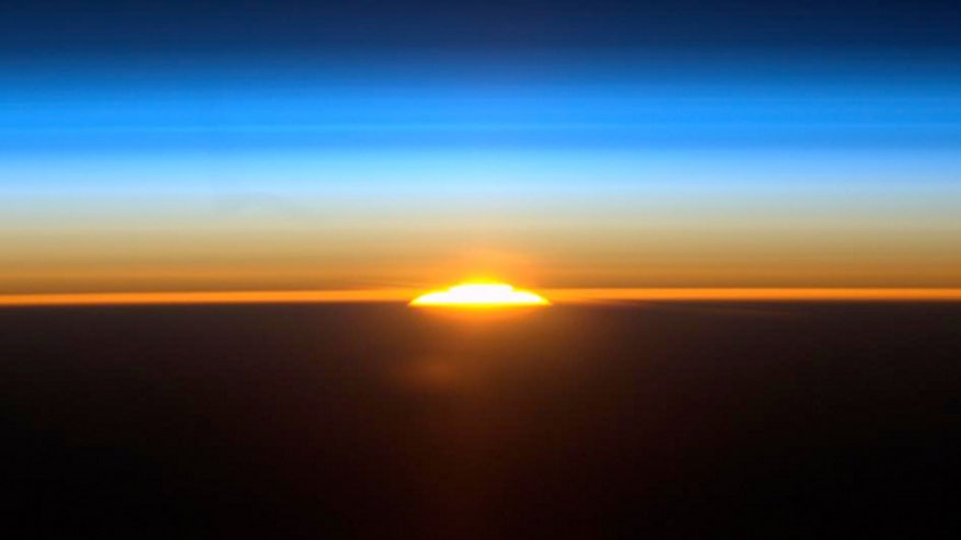 iss-astronaut-sunrise