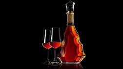 Wine culled from the chalky soil of France’s Cognac region has a tendency to be acidic, thin and unpalatable. This might have doomed the terroir to gastronomic obscurity, had the region’s vintners not been fortunate enough to discover that this wine was excellent for distilling. It so exemplified this ability, in fact, that the region’s brandy varietals gradually assumed the name of their otherwise-maligned home and Cognac became a beverage of choice the world over. Produced from the combination of various white wines (known as “eaux de vie”), Cognacs are aged to maturity in barrels before bottling and distribution. In the course of its centuries-long life Cognac has been considered a drink for the poor, an exclusive property of upscale gentlemen’s clubs and a symbol of hip-hop excess. At present, Cognac distillers draw from all facets of this varied past to create some of the finest tasting and most exclusive liquors on the planet.