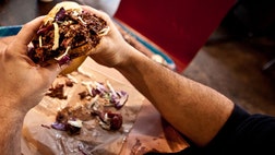 >It’s that time of year when a man’s mind starts to turn to thoughts of hot, steaming piles of meat, served atop fluffy white bread, drowned in tangy, rich sauce, and accompanied by buckets of slaw, mac and cheese, potato salad, and about 17 buckets of ice cold beer. Now that we think about it, there isn’t actually a time of year when we’re not dreaming of barbecue, but with summer coming up, it seems as good a time as any to plan a road trip to the following meat masters. &nbsp;