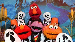 >From hay rides to scare zones, theme parks roll out the orange-and-black carpet.