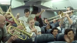 Passengers on a delayed Air Canada flight from Toronto to Frankfurt got to hear a four-piece set by the band Lemon Bucket Orkestra who broke out their instruments in economy class.