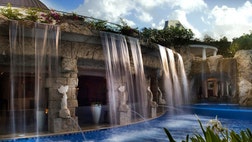 We love an infinity pool, and a pool with a view—but a pool with the added bonus of a waterfall? Well, we must be in heaven. Check out these amazing properties and bask in the blissful beauty yourself.