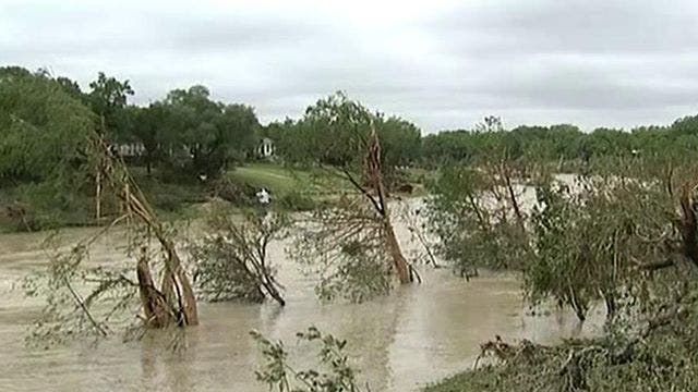 At least 3 dead, hundreds of homes destroyed as flash flooding.