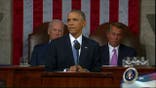 Obama pushes tax plan, wields veto pen in defiant State of the Union address