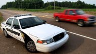 Mississippi police are warning drivers to beware of who is pulling them over while they investigate a woman's claim that she was stopped last month by a fake police officer in their hunt to find a suspected police impersonator who may have murdered two people.