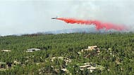 Remains of two people have been found in an area burned by a wildfire that has destroyed at least  houses northeast of Colorado Springs.