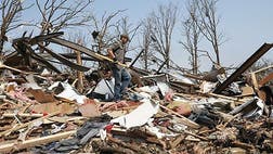 A massive tornado at least a half mile-wide with mph winds churned through Oklahoma City's suburbs Monday afternoon, flattening entire neighborhoods and destroying an elementary school with a direct blow as children and teachers huddled against winds up to  mph. At least  people were killed, and officials said the death toll was expected to rise.