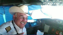 >A United Airlines pilot died after suffering a major heart attack while flying from Houston to Seattle, forcing crew members to make an emergency landing in Idaho while two doctors on board did CPR in the first-class cabin.
